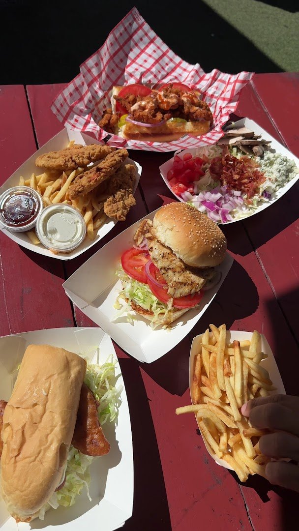 Takeout spot with burgers and fries.