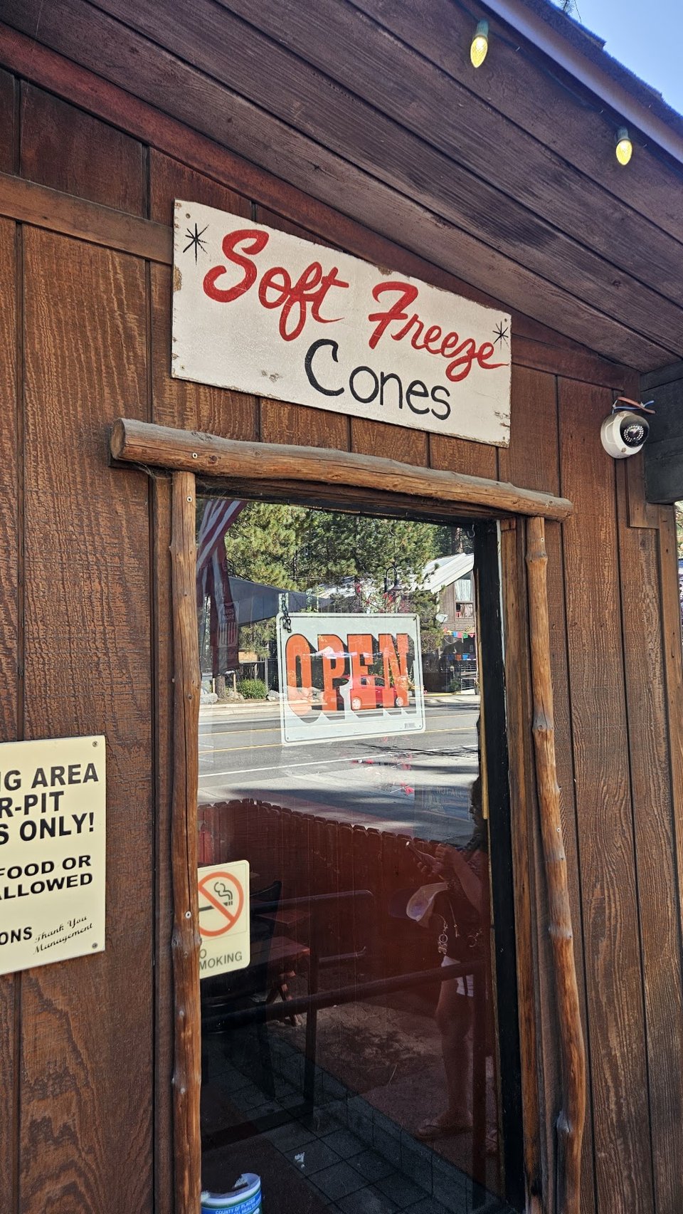 Menu board for burgers, sandwiches, and hot dogs.