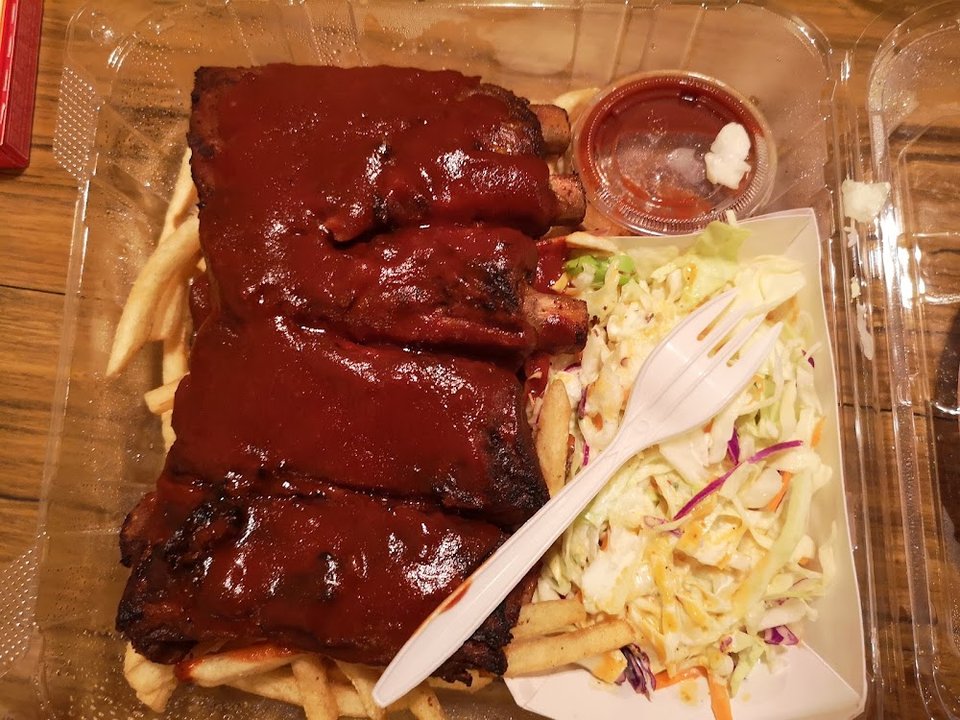 Printed menu showing fryer items and sides.